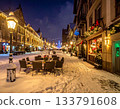 A sidewalk at night illuminated with winter lights 133791608