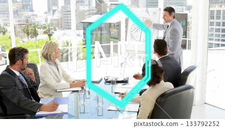Pointing presenter in suit showing pie-chart graphics on glass wall in meeting room, with notepads 133792252