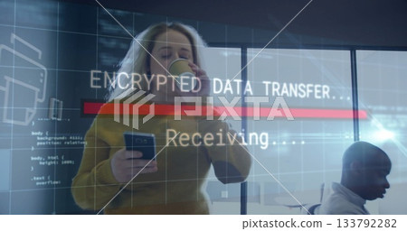 Woman in yellow sweater holding smartphone and sipping coffee at office window, with data overlay Woman in yellow sweater holding smartphone and sipping coffee at office window, with data overlay 133792282