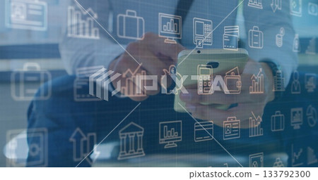 Holding smartphone, business professional tapping screen at glass-topped desk, with financial icons Holding smartphone, business professional tapping screen at glass-topped desk, with financial icons 133792300