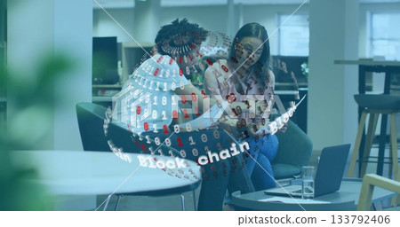 Discussing blockchain technology, diverse colleagues with digital binary globe overlay in office Discussing blockchain technology, diverse colleagues with digital binary globe overlay in office 133792406