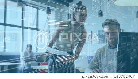 Teen girl in striped skirt and top manipulating digital interface overlays in office, with monitors 133792407