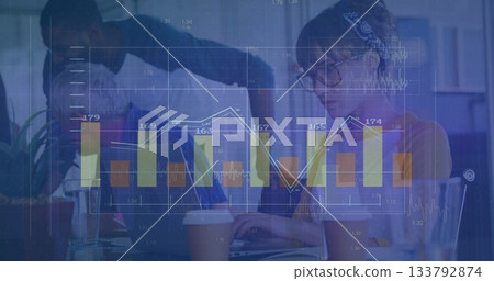 Reviewing team of five analyzing holographic financial charts in office, with laptop and coffee 133792874