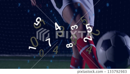 Preparing player's legs in red socks driving soccer ball on stadium turf, with analytics overlay Preparing player's legs in red socks driving soccer ball on stadium turf, with analytics overlay 133792983