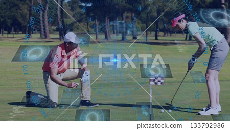 Golfers on green course preparing to putt with image data overlay Golfers on green course preparing to putt with image data overlay 133792986