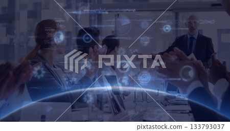 Applauding business team sitting around boardroom table, with floating digital charts and graphs Applauding business team sitting around boardroom table, with floating digital charts and graphs 133793037