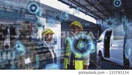 Three engineers wearing helmets scanning data holograms in warehouse, with service van 133793134