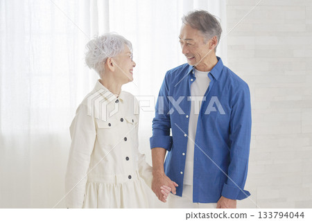 Senior couple having a conversation in the living room Senior couple having a conversation in the living room 133794044