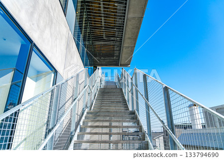[Tokyo] The exterior stairs of Komazawa Park Quarter under a refreshing blue sky 133794690