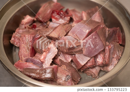 Bigeye tuna being prepared and washed in hot water Bigeye tuna being prepared and washed in hot water 133795223