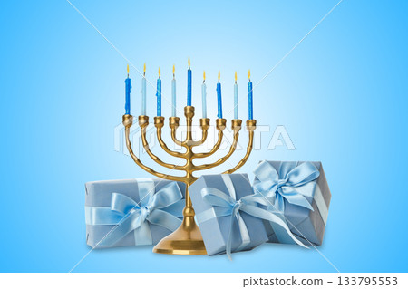 Blue candles in a menorah with gifts on a blue backdrop Blue candles in a menorah with gifts on a blue backdrop 133795553