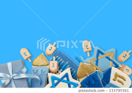 Decorative hanukkah cookies and dreidels on blue background 133795561