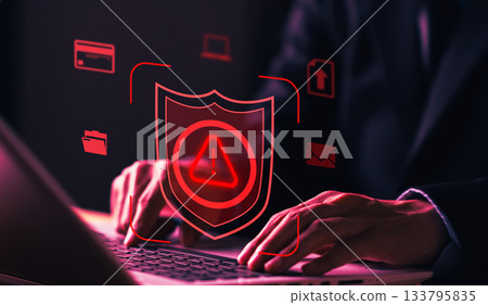 Cybersecurity concept with shield alert icon and man working on laptop, representing data protection, system security, cyber attack prevention, and digital defense. Cybersecurity concept with shield alert icon and man working on laptop, representing data protection, system security, cyber attack prevention, and digital defense. 133795835