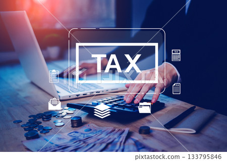 Businessman calculating tax with money, calculator and laptop on desk. Concept for financial planning, tax return, accounting, finance management, income, expenses, or IRS preparation. Businessman calculating tax with money, calculator and laptop on desk. Concept for financial planning, tax return, accounting, finance management, income, expenses, or IRS preparation. 133795846