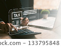 Close-up of hand using calculator with digital tax checklist interface, suitable for financial reports, income tax return, tax preparation, and online accounting services. 133795848