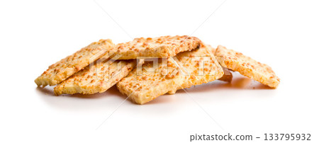Crunchy salted crackers isolated on white background. Crunchy salted crackers isolated on white background. 133795932