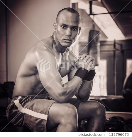 Shirtless young man sitting at gym 133796073