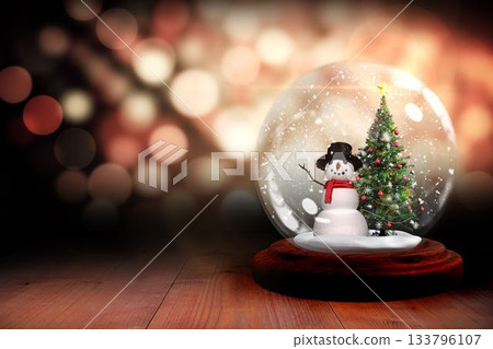 Christmas tree and snowman in snow globe Christmas tree and snowman in snow globe 133796107