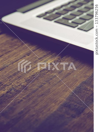 Close-up of laptop on table Close-up of laptop on table 133796256