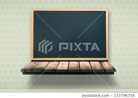 Black board on a wooden shelf Black board on a wooden shelf 133796356