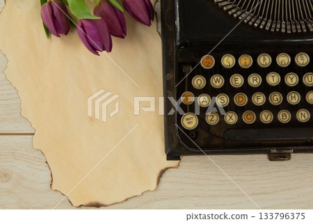 Typewriter and flowers on table Typewriter and flowers on table 133796375