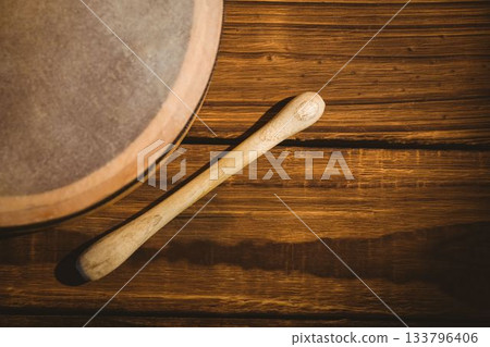Cropped image of wooden bodhran with stick Cropped image of wooden bodhran with stick 133796406