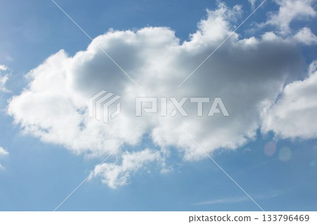 Flat design illustration is showing large fluffy cumulus cloud floating against bright blue sky 133796469