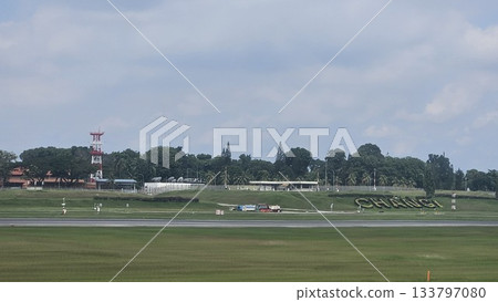 Changi Airport lush greenery spells its name beside a busy runway Changi Airport lush greenery spells its name beside a busy runway 133797080
