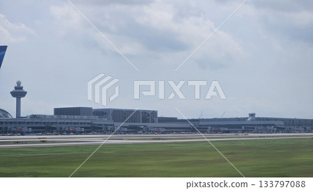 Changi Airport lush greenery spells its name beside a busy runway Changi Airport lush greenery spells its name beside a busy runway 133797088