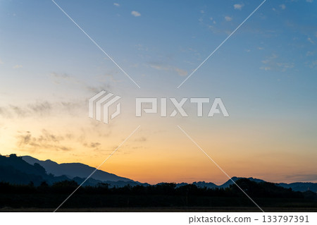 Sunset over the mountains 133797391