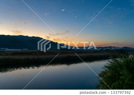 Sunset over the mountains 133797392