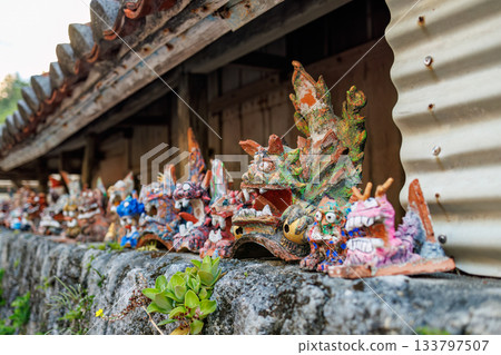 A sacred place in an alleyway. There are shisa statues, a small shrine, and a buffalo skull. Zamami Port, Zamami Island, Kerama Islands, Shimajiri District, Okinawa Prefecture 133797507