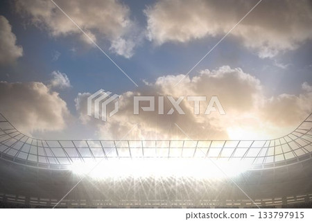 Large football stadium with spotlights under blue sky with clouds Large football stadium with spotlights under blue sky with clouds 133797915