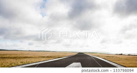 Flat design illustration is showing asphalt runway extending toward distant hills with grass fields 133798094