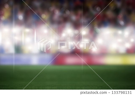 Flat design football stadium is featuring grassy pitch, lit floodlights, blurred stands, ad boards Flat design football stadium is featuring grassy pitch, lit floodlights, blurred stands, ad boards 133798131