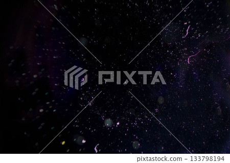 Luminescent specks and faint purple white streaks are drifting in dark void digital illustration Luminescent specks and faint purple white streaks are drifting in dark void digital illustration 133798194