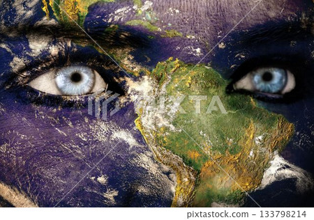 Composite illustration is showing Earth rotating with overlaid blue eyes on transparent background Composite illustration is showing Earth rotating with overlaid blue eyes on transparent background 133798214