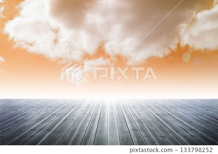 Flat design showing wooden deck extending toward horizon under orange sky with subtle lens flare Flat design showing wooden deck extending toward horizon under orange sky with subtle lens flare 133798252