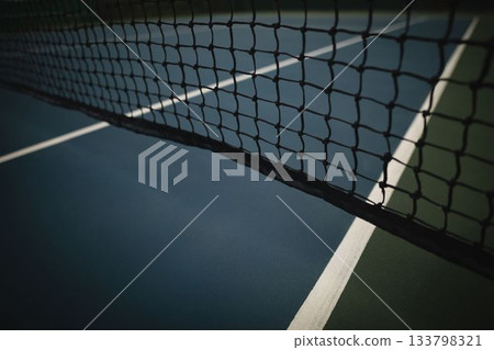 Tennis net is being shown in flat design outdoor court, with white lines and green edge 133798321
