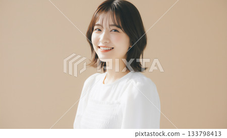 Natural portrait of a young woman with a gentle smile 133798413