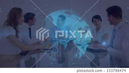 Discussing business team reviewing data in modern boardroom, with holographic globe projection Discussing business team reviewing data in modern boardroom, with holographic globe projection 133798474