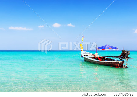 Traditional local long tail boat on a beautiful tropical beach in sunny day, in Phuket, Thailand 133798582