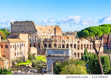 The Colosseum is one of the main tourist attractions in Rome, Italy. View of the ancient Roman ruins of the Colosseum through the Roman Forum. Landscape of ancient Rome, Italy. 133798605