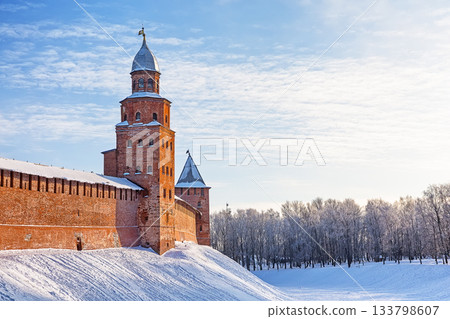 The Kokuy Tower of the Novgorod Kremlin on a winter day in Veliky Novgorod, Russia. The Kremlin wall in Veliky Novgorod during a frosty winter sunset. 133798607