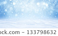 A winter Christmas snow background with snowdrifts and beautiful bokeh lights with snowflakes and garlands. Banner format, copy space. 133798632