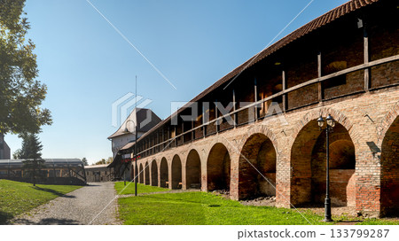 Historic Transylvanian Fortress Targu Mures Defensive Walls and Arches Under Clear Sky 133799287