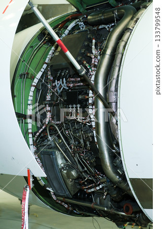 Overview of jet engine internal components showing complex machinery and structures within the engine casing at an aircraft maintenance facility 133799548
