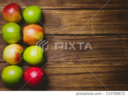 Red and green apples on table Red and green apples on table 133799672