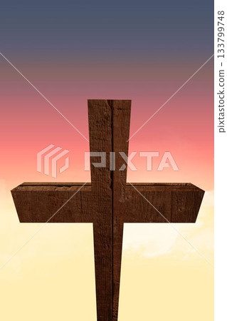 Weathered wooden cross is standing against gradient sky in vector flat design, sunrise glow Weathered wooden cross is standing against gradient sky in vector flat design, sunrise glow 133799748