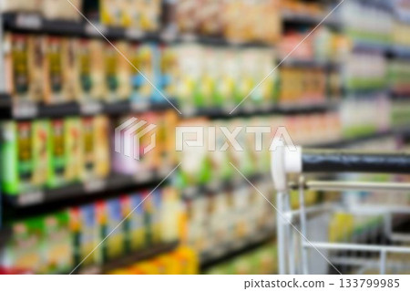 Cropped image of shopping cart amidst products Cropped image of shopping cart amidst products 133799985